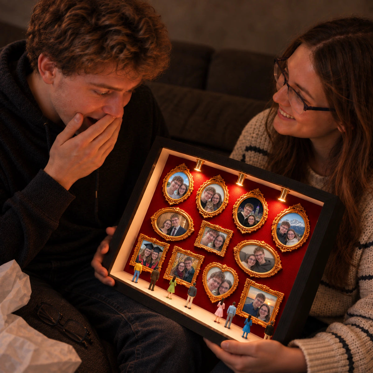 A man reacting emotionally as his girlfriend gives him the lit Museum of Us photo shadow box